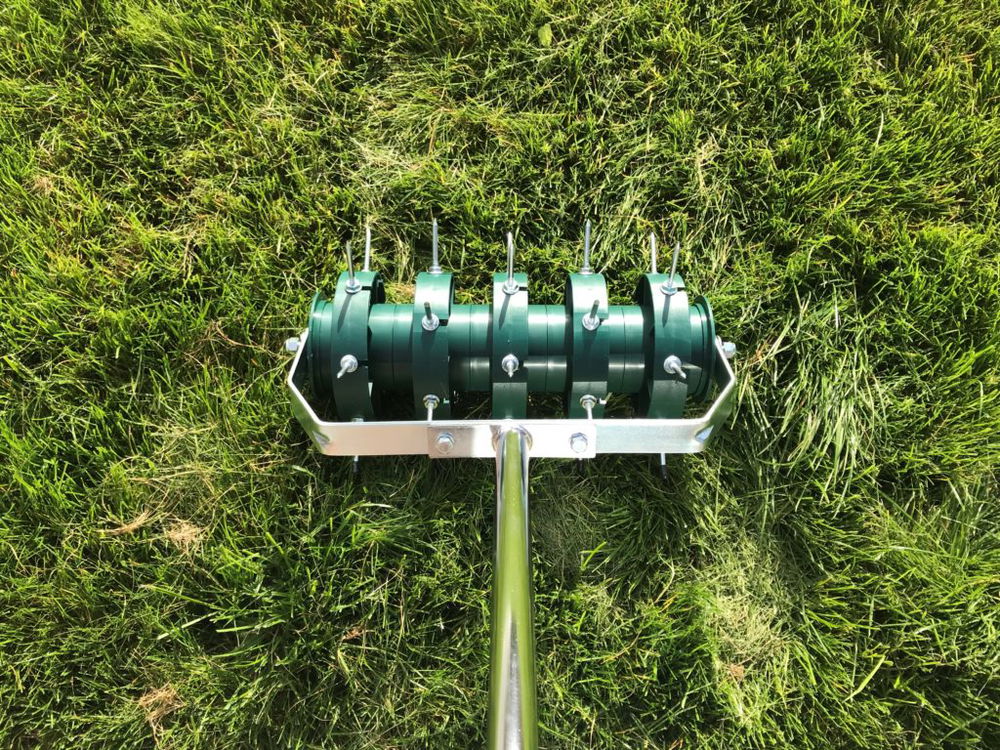 Aerating roller on grass
